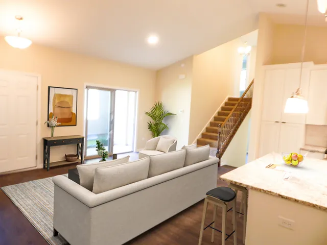 a living room with furniture and a large window