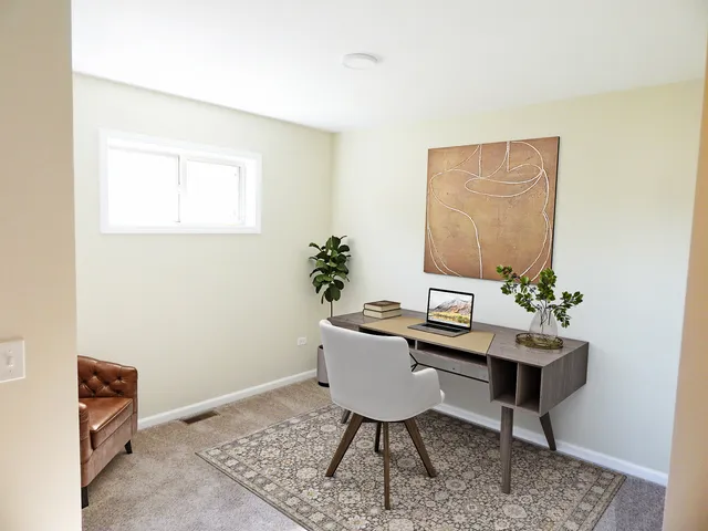 a view of a workspace with furniture