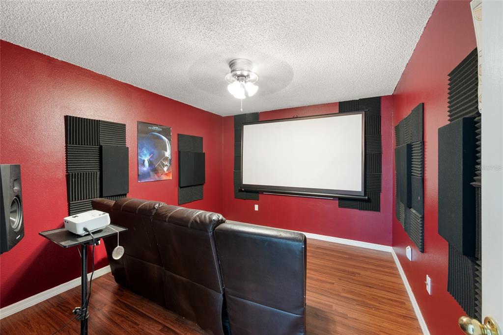 8714 Martinique Lane Port Richey, FL 34668 - Photo 14 of 34 a living room with furniture and a flat screen tv