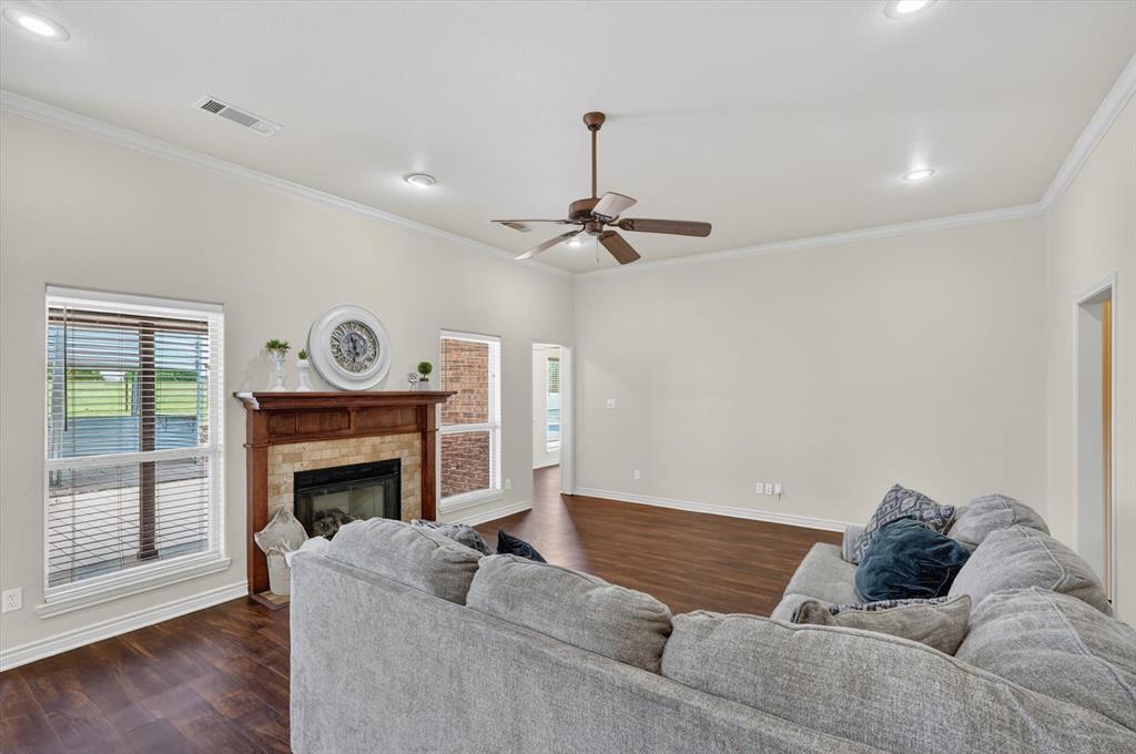 2828 Bennett Road Howe, TX 75459 - Photo 7 of 39 a living room with furniture and a fireplace