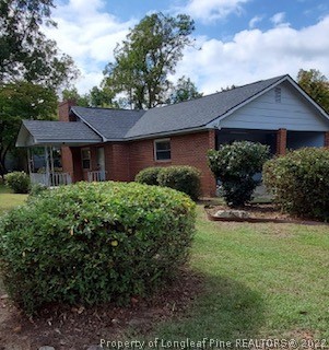 5146 Matt Hair Road Fayetteville, NC 28312 - Photo 3 of 23 a view of a house with garden and yard