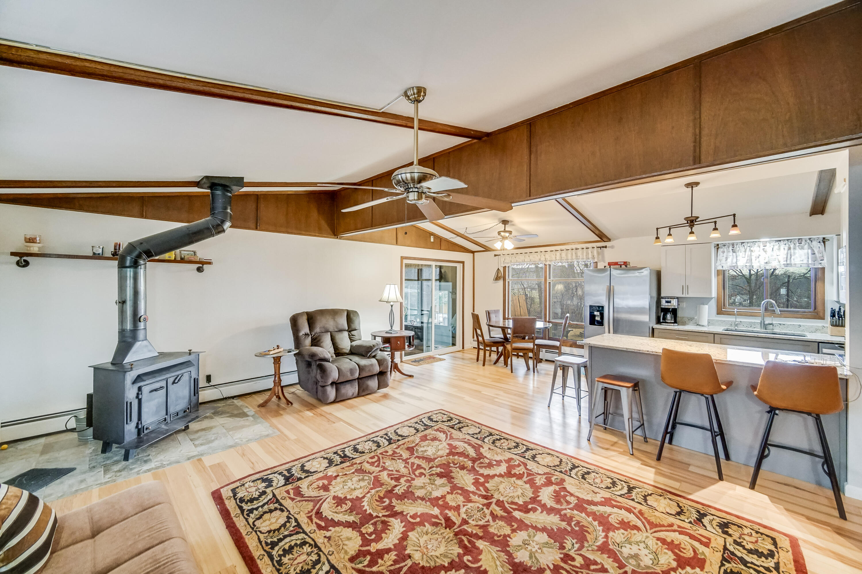 5203 Vasa Terrace Lowell, IN 46356 - Photo 3 of 33 a dining room with wooden floor a table and chairs
