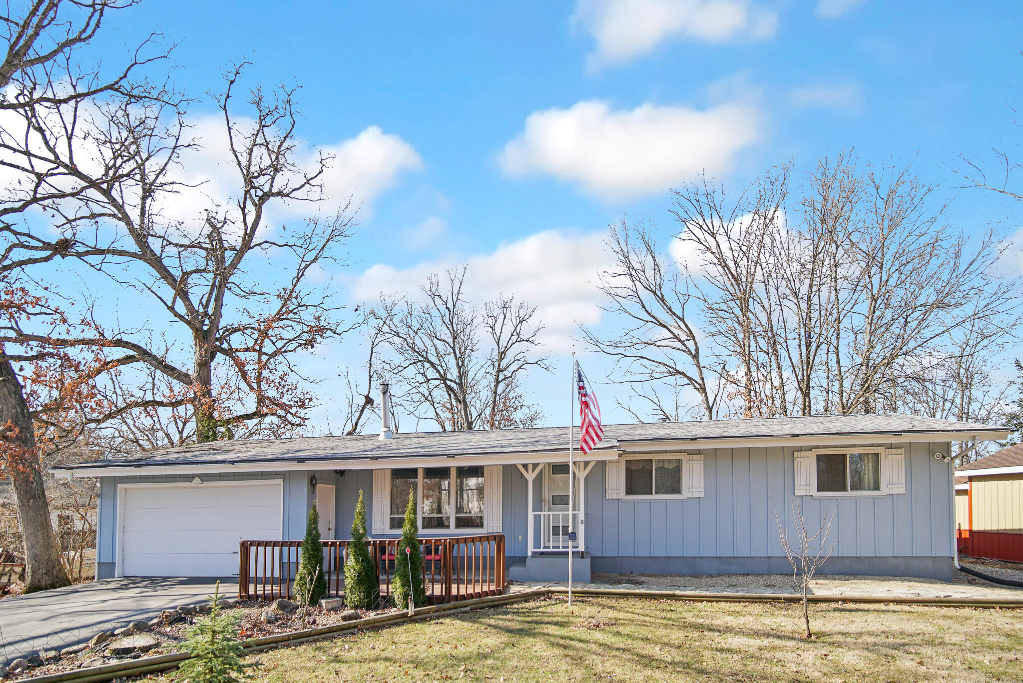 5203 Vasa Terrace Lowell, IN 46356 - Photo 33 of 33 a backyard of a house with large trees and barbeque oven