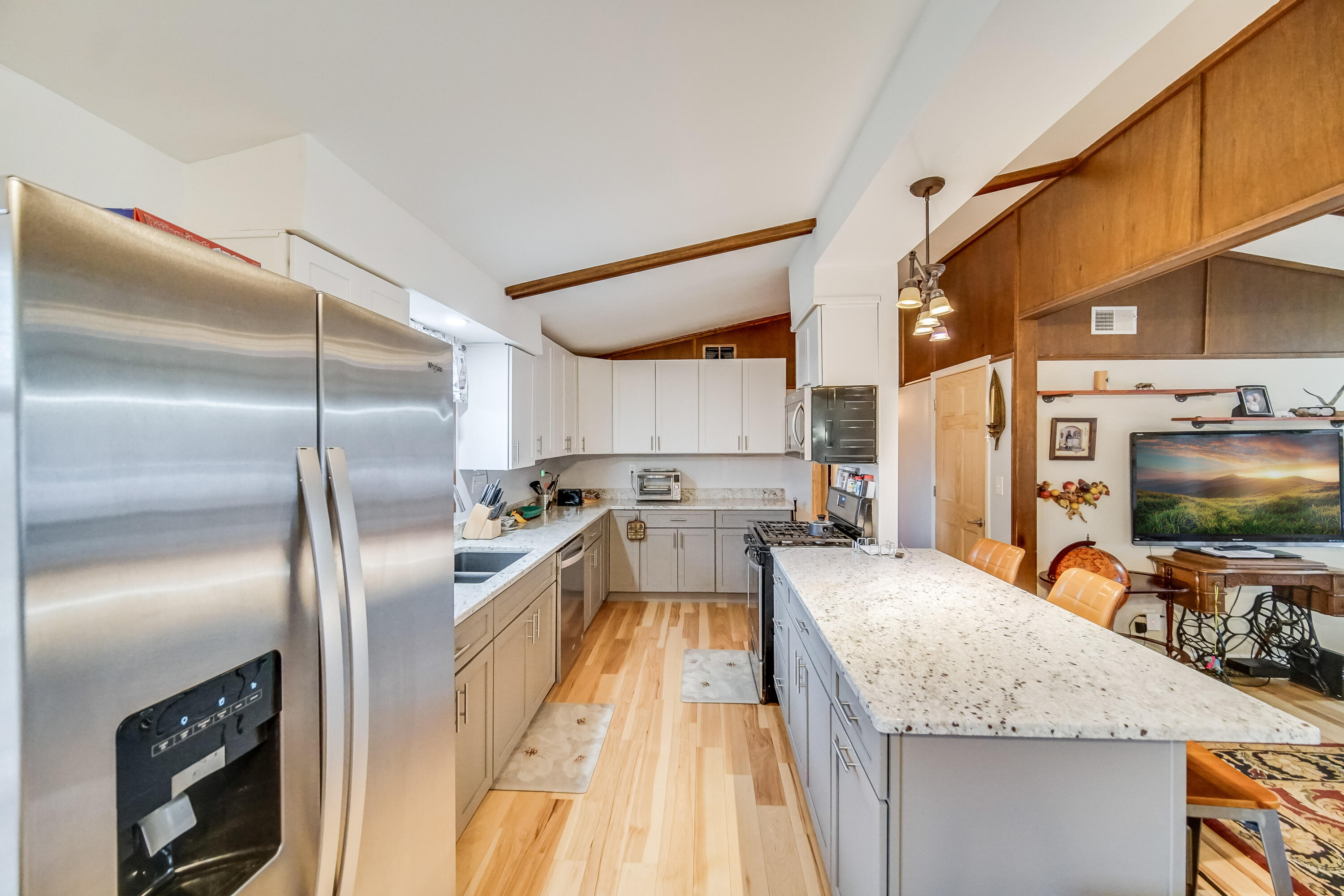 5203 Vasa Terrace Lowell, IN 46356 - Photo 6 of 33 a kitchen with stainless steel appliances granite countertop a sink stove and refrigerator