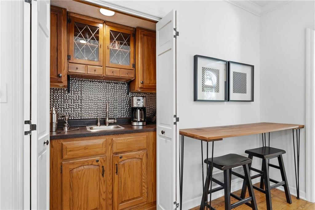 900 Settlers Ridge Road Pittsburgh, PA 15238 - Photo 11 of 50 A convenient yet discreet wet bar enhances the family room, making entertaining effortless.