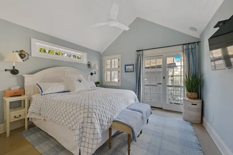 a bedroom with a bed and a couch
