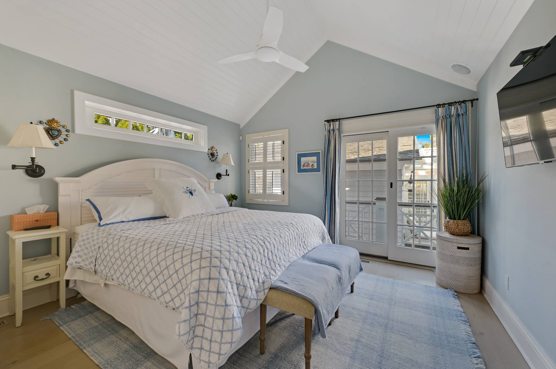5 Ridge Drive Sag Harbor, NY 11963 - Photo 10 of 27 a bedroom with a bed and a couch