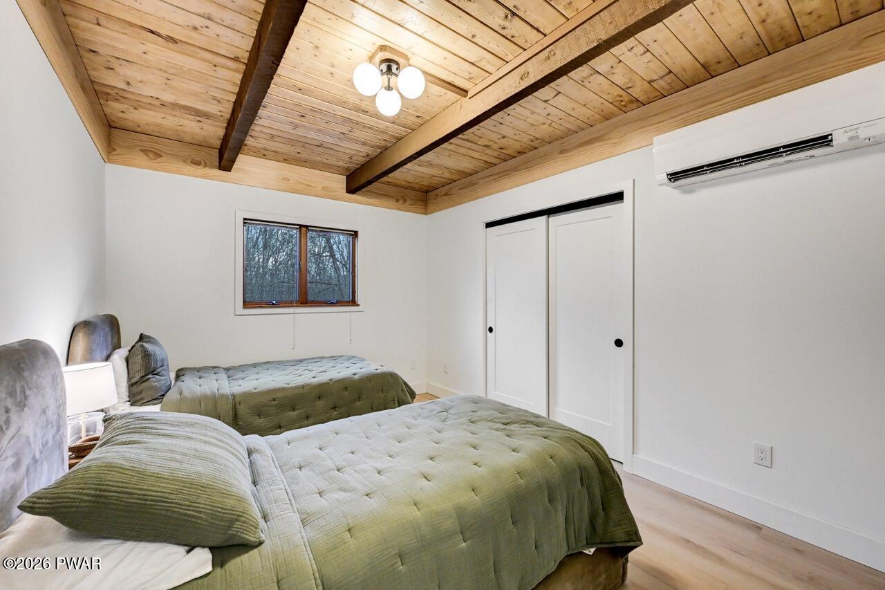 258 Lakeview Road Lackawaxen, PA 18435 - Photo 29 of 119 a bedroom with a bed and a window