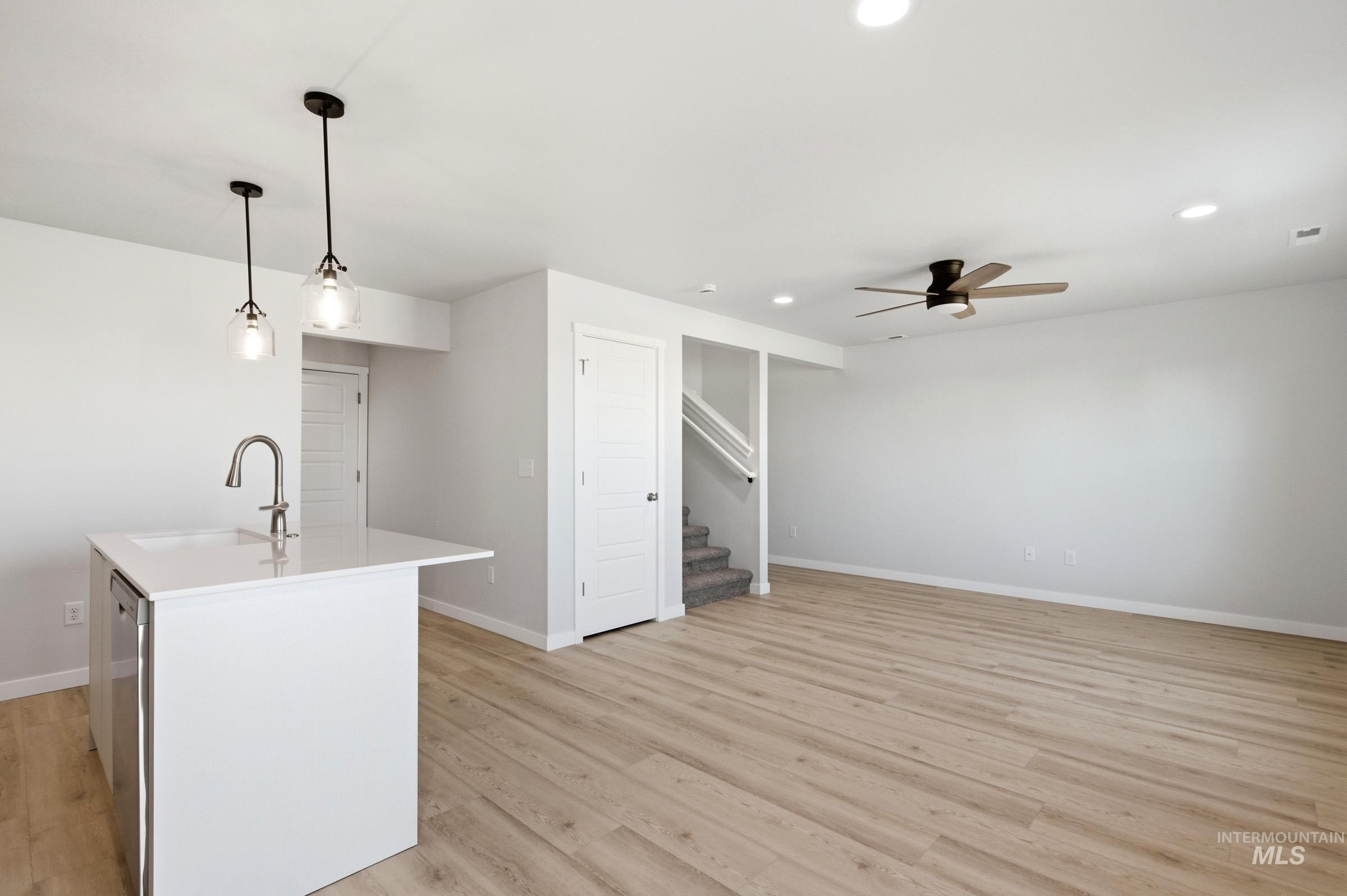 10800 Rutland Street Caldwell, ID 83605 - Photo 9 of 21 Open-concept living space featuring wood-finish flooring, a contemporary ceiling fan, and recessed lighting