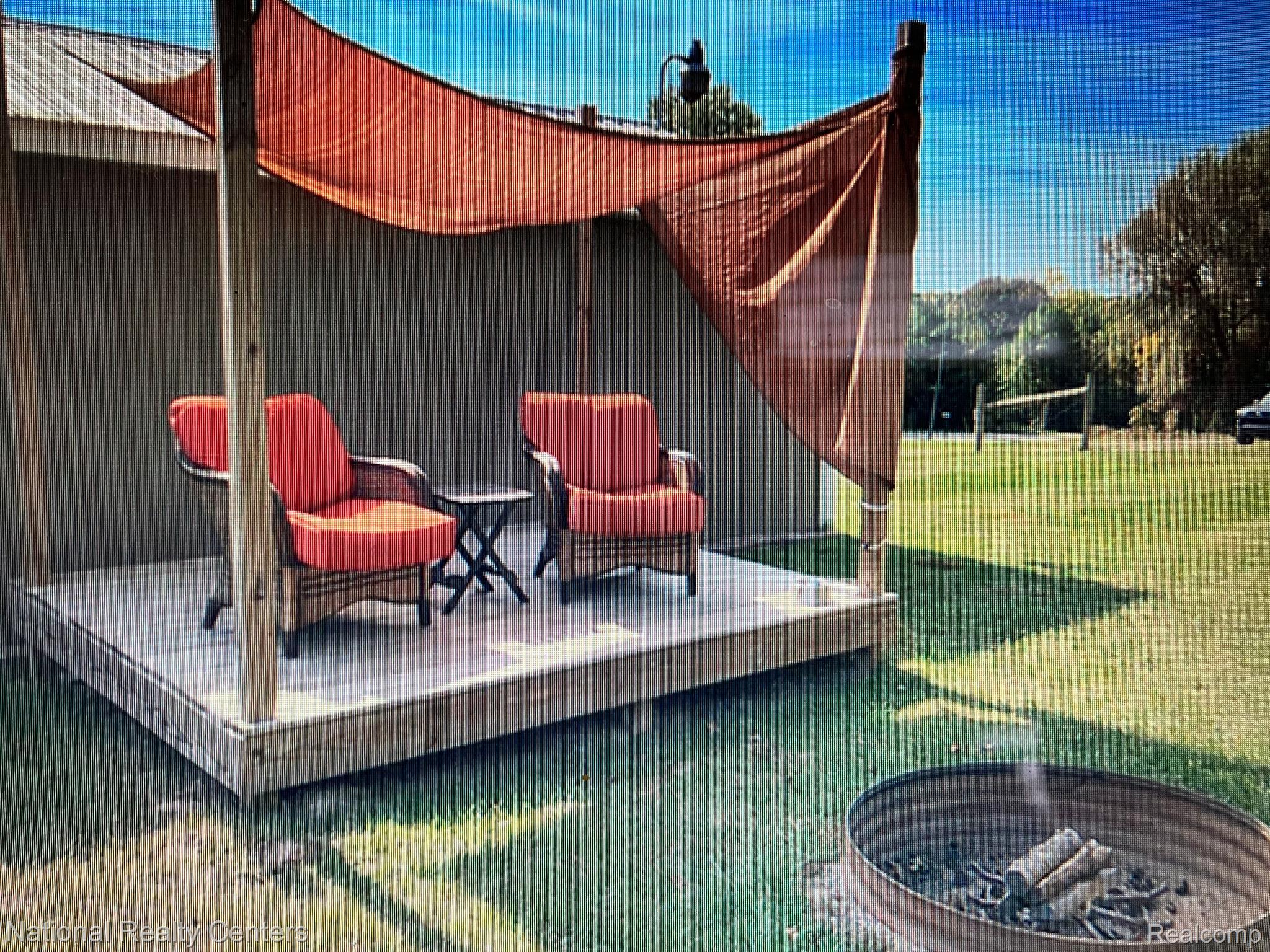 1220 Pratt Road Metamora, MI 48455 - Photo 4 of 12 Back deck and fire pit