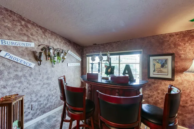 a kitchen with a stove and a refrigerator