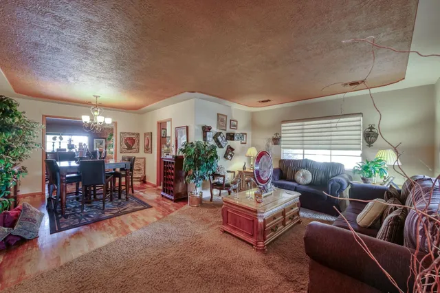 a room with pool table and windows