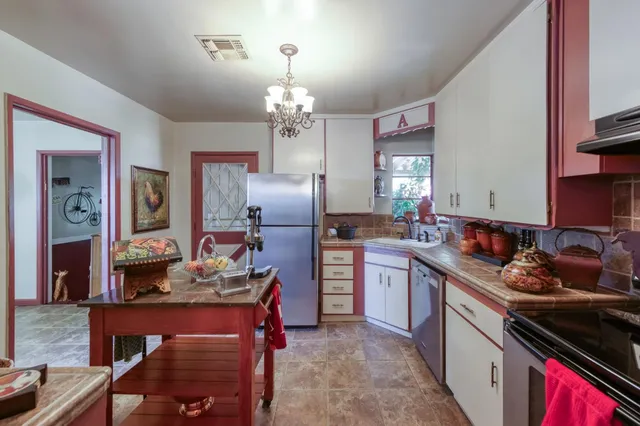 a room with pool table and windows