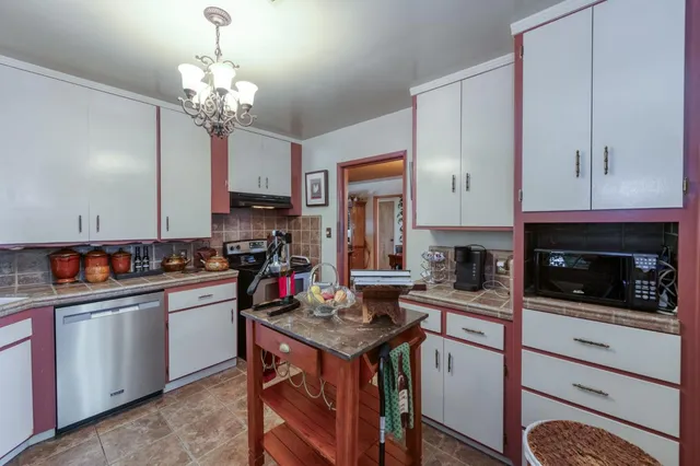 a bedroom with bed and window