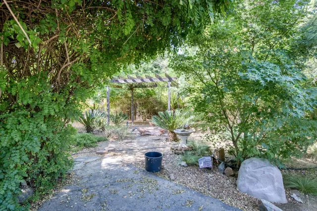a view of a house with a yard and garage