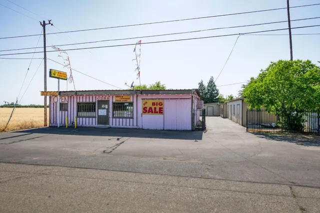 a bedroom with a bed and a mirror