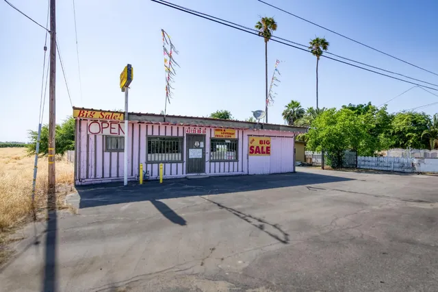 a view of a backyard with a car parked in it