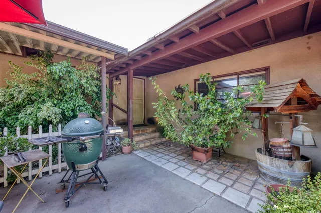 a living room with furniture a couch and a window