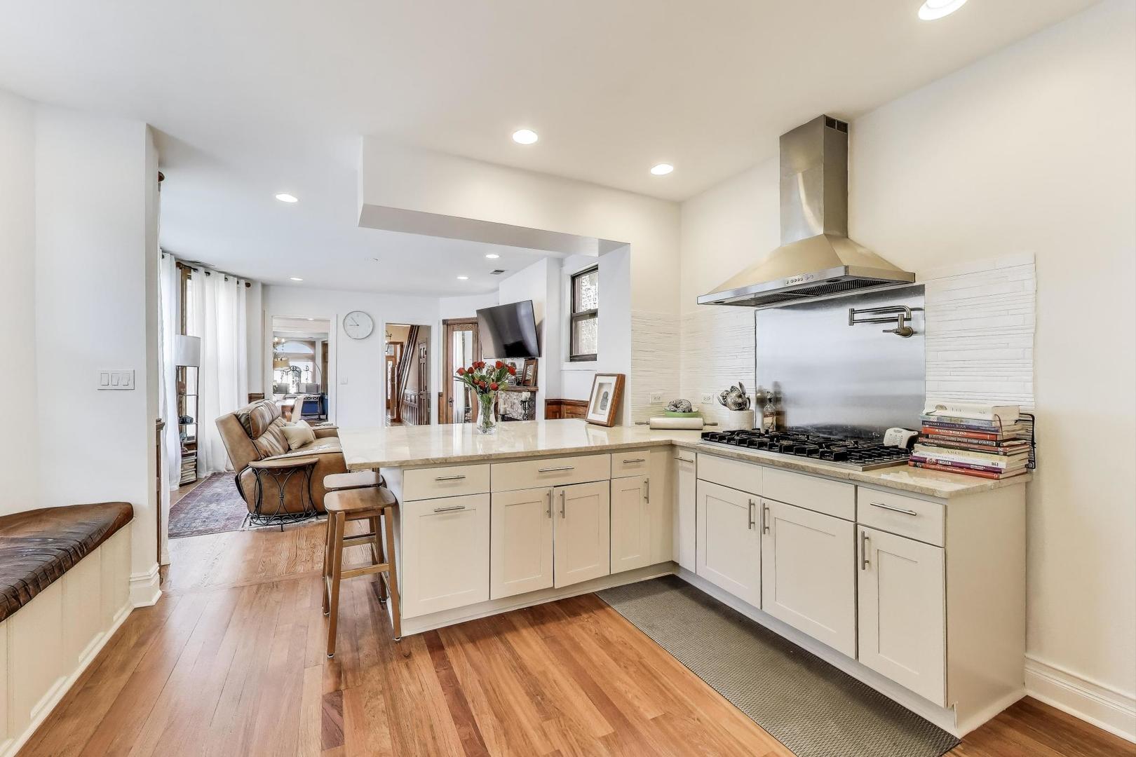 4553 South Ellis Avenue Chicago, IL 60653 - Photo 13 of 62 a kitchen with sink stove and cabinets