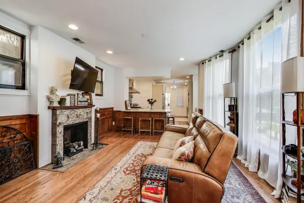 a view of a livingroom with furniture and an empty room