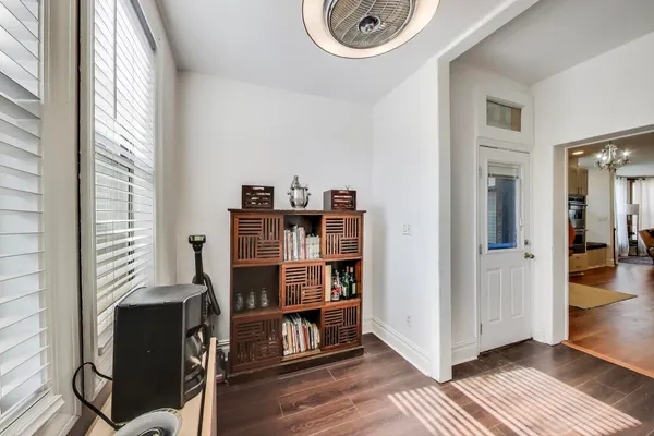 a bedroom with a large bed and a flat screen tv