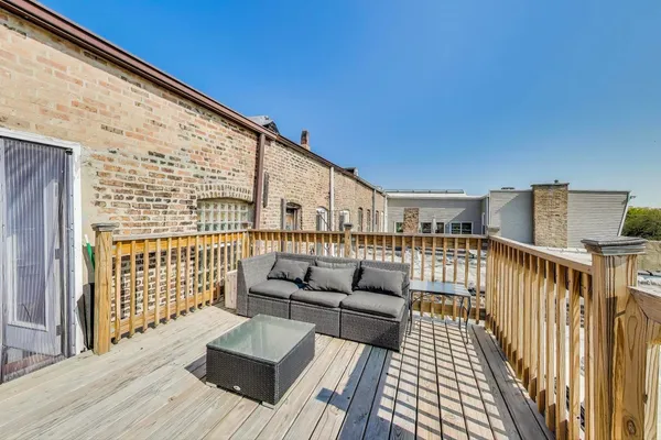 a view of a backyard with sitting area