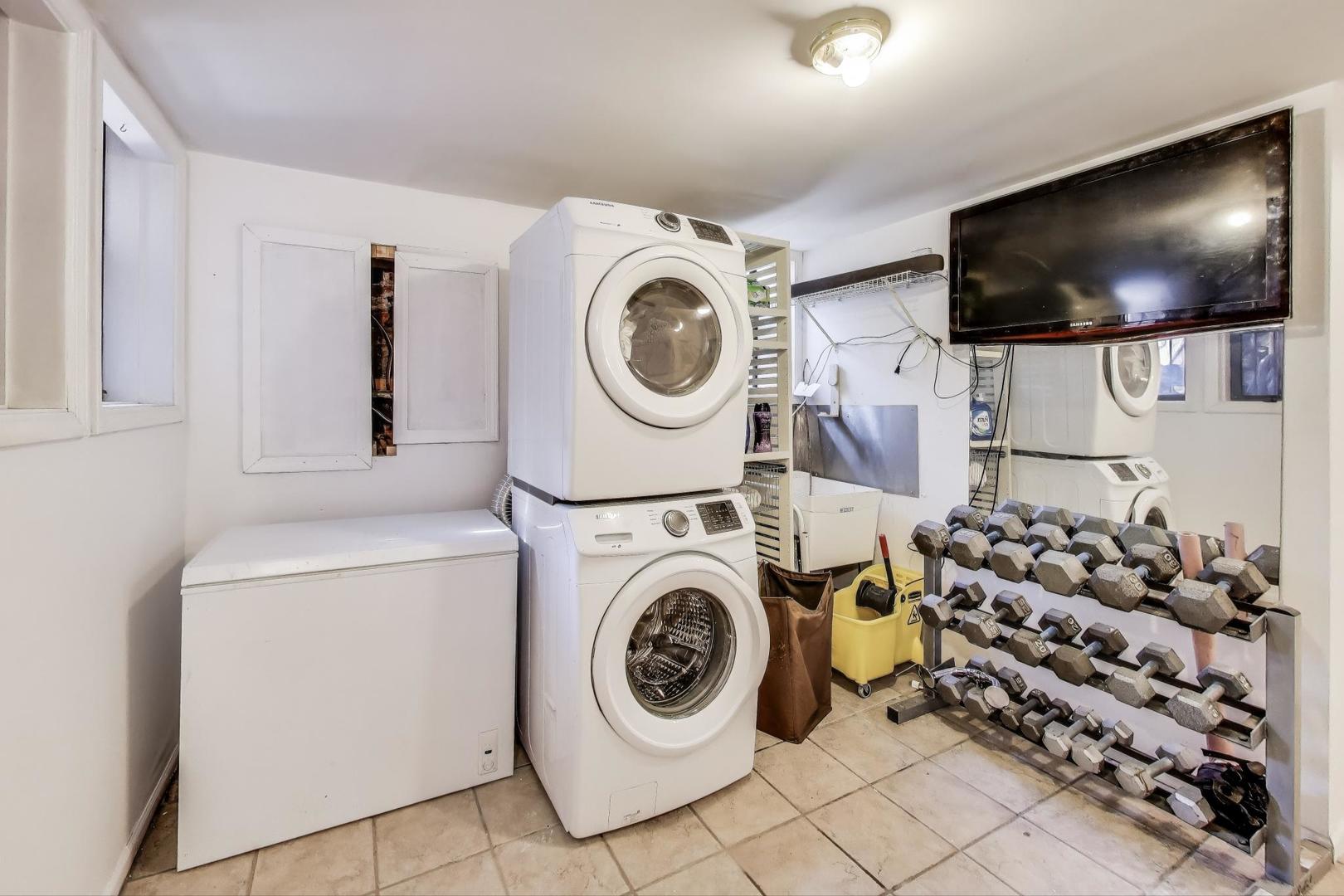 4553 South Ellis Avenue Chicago, IL 60653 - Photo 55 of 62 a view of a storage & utility room with washer and dryer