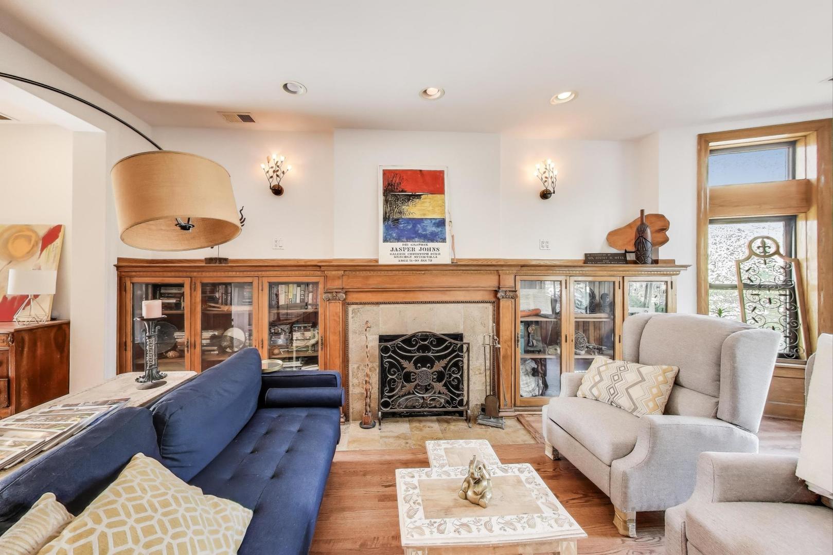 4553 South Ellis Avenue Chicago, IL 60653 - Photo 7 of 62 a living room with furniture and a fireplace