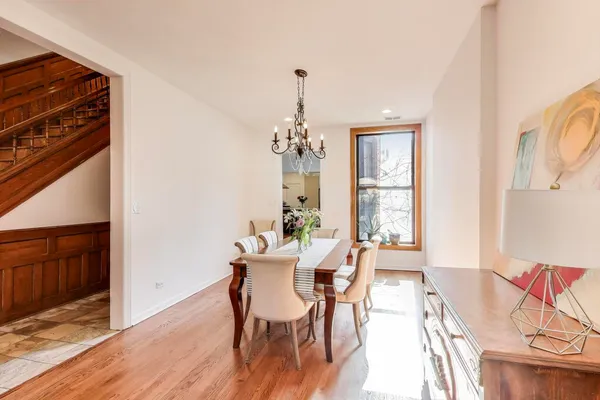 a kitchen with stainless steel appliances kitchen island granite countertop a refrigerator and a stove top oven
