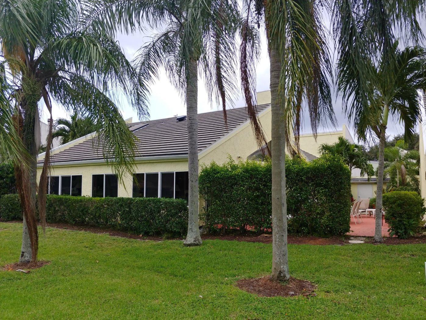 17042 Traverse Circle Jupiter, FL 33477 - Photo 30 of 30 a front view of house with yard and green space