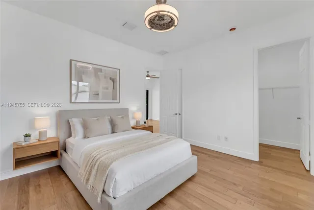 a bedroom with bed and a window