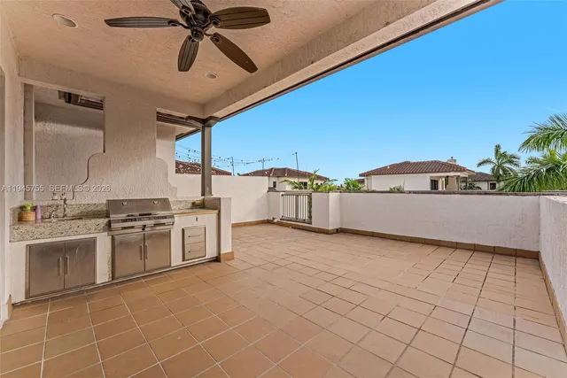 a kitchen with stainless steel appliances granite countertop a sink and cabinets