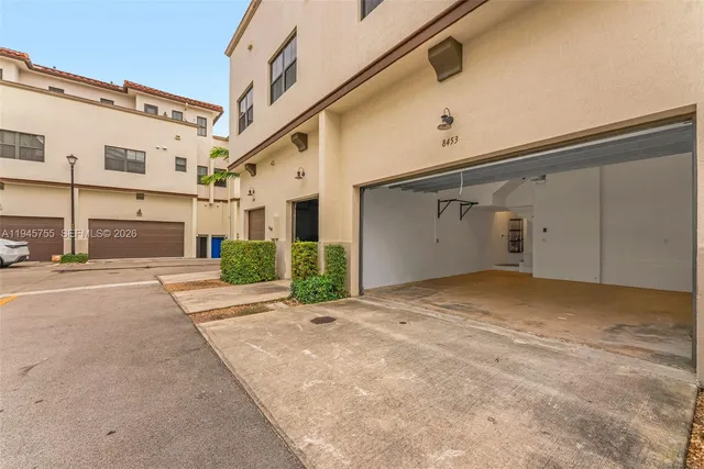 a view of a parking space in front of a building