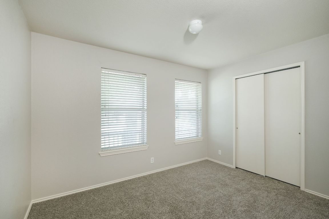 495 Atlantis Kyle, TX 78640 - Photo 13 of 14 an empty room with windows