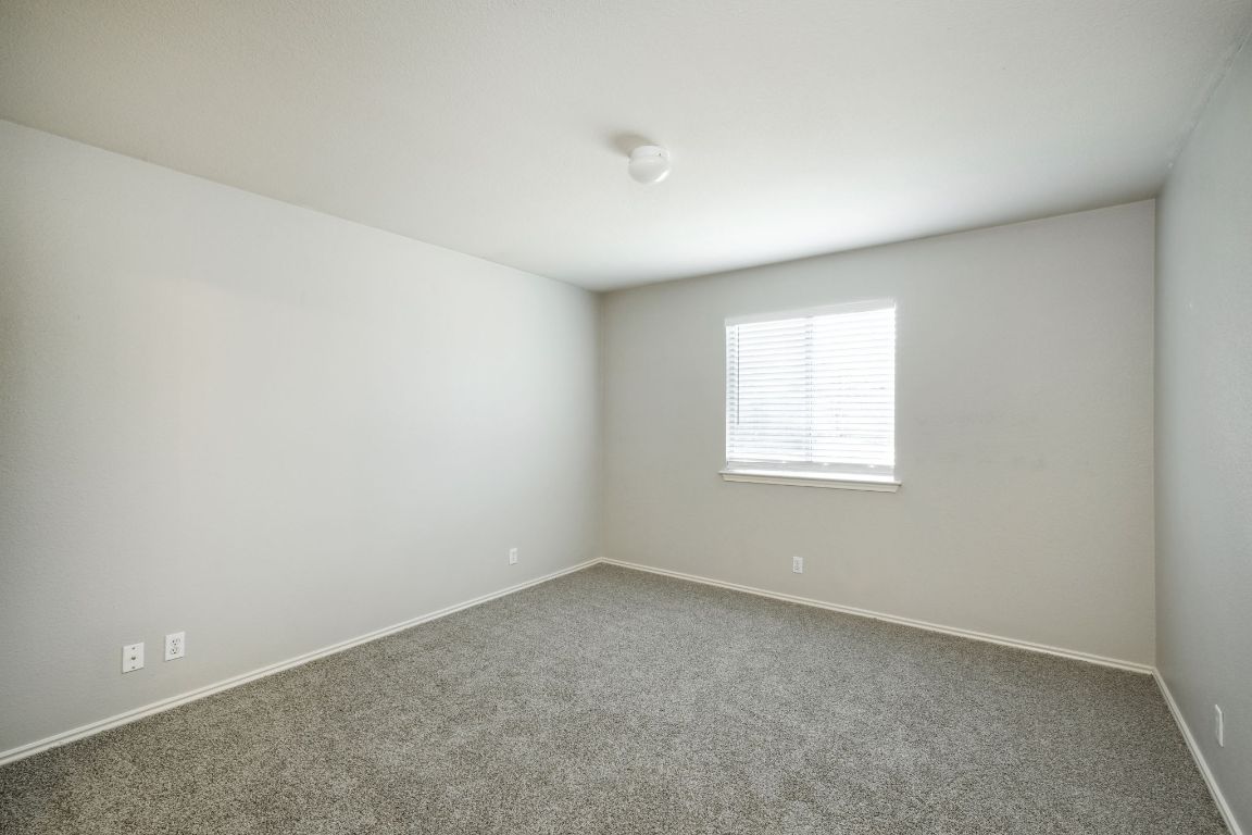 495 Atlantis Kyle, TX 78640 - Photo 5 of 14 an empty room with a window