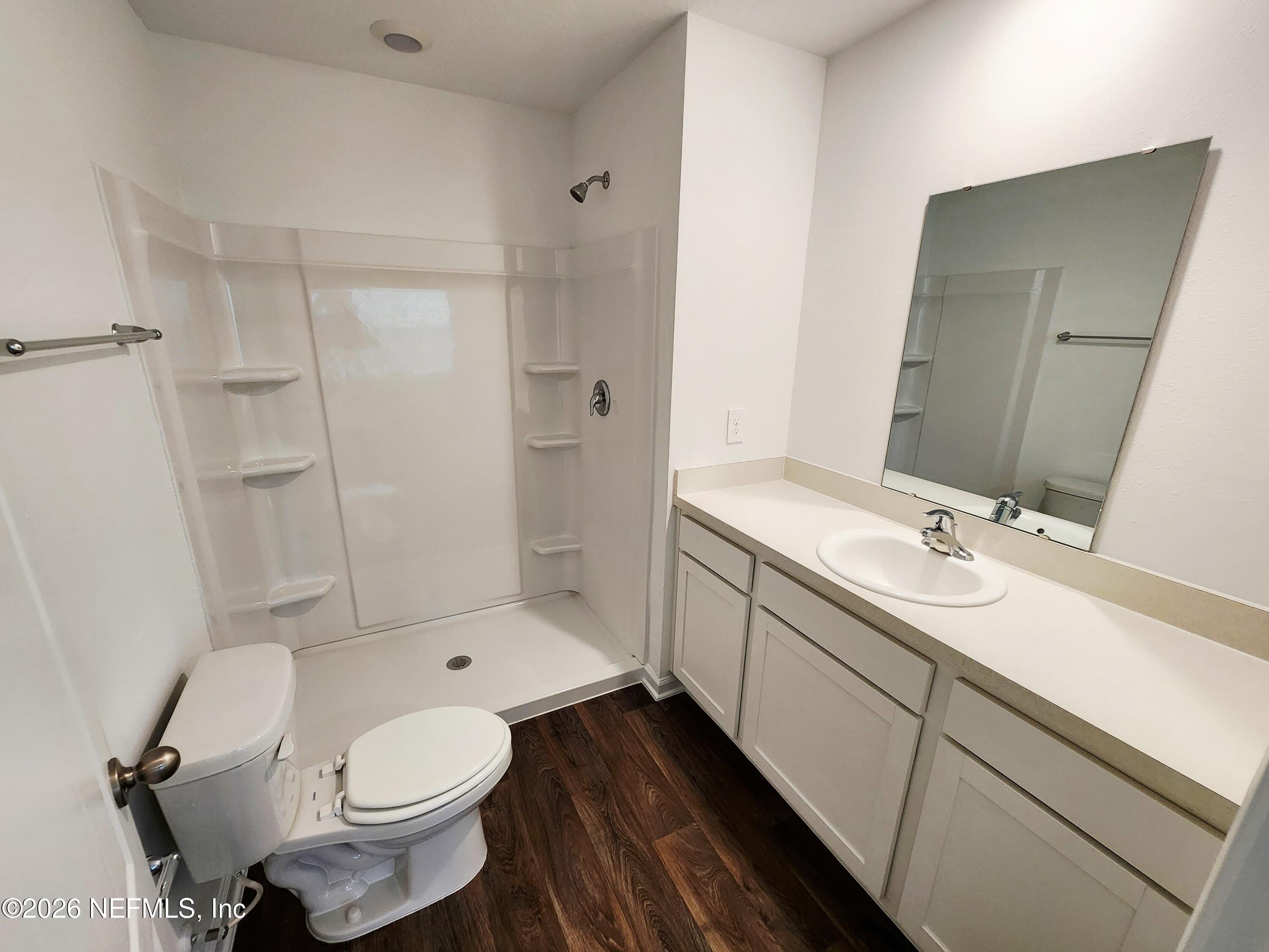 51 Palmetto Rdg Road St. Augustine, FL 32095 - Photo 12 of 16 a bathroom with a sink toilet vanity and shower