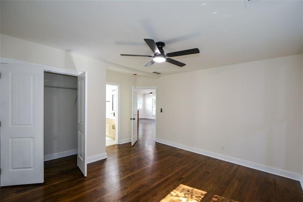 1275 Westridge Road Southwest Atlanta, GA 30311 - Photo 15 of 38 a view of an empty room with wooden floor