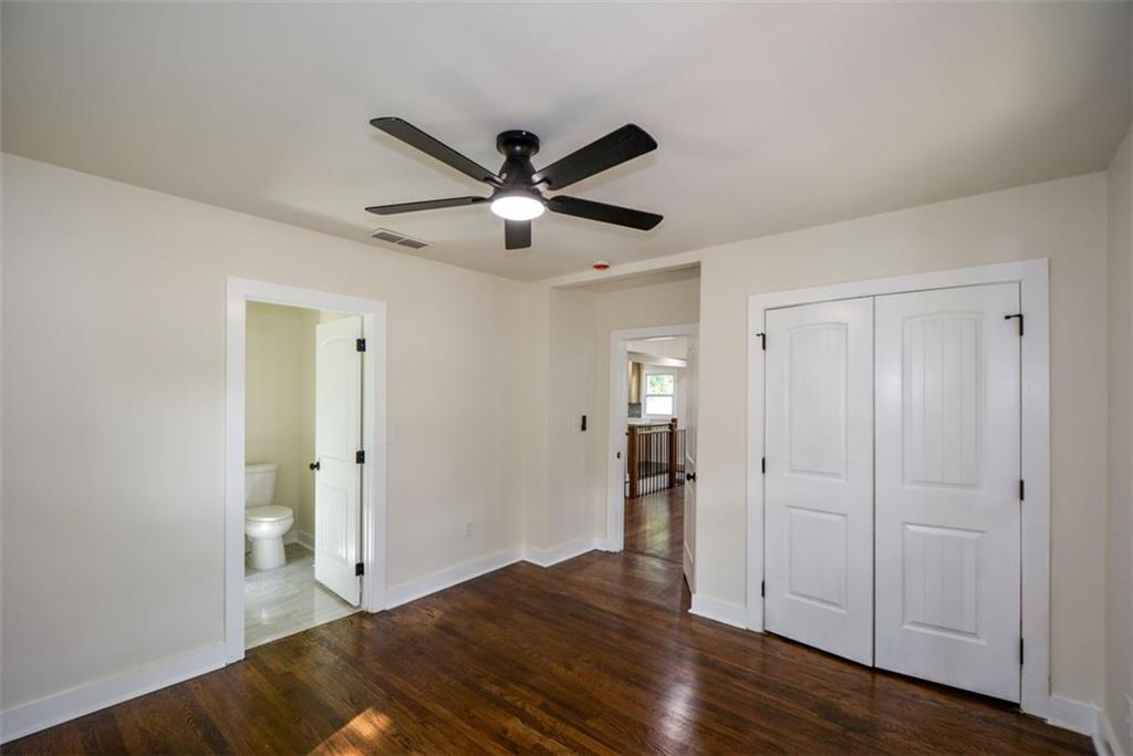 1275 Westridge Road Southwest Atlanta, GA 30311 - Photo 19 of 38 a view of empty room with wooden floor
