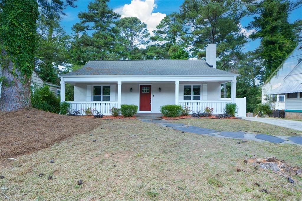 1275 Westridge Road Southwest Atlanta, GA 30311 - Photo 2 of 38 a front view of house with yard and green space