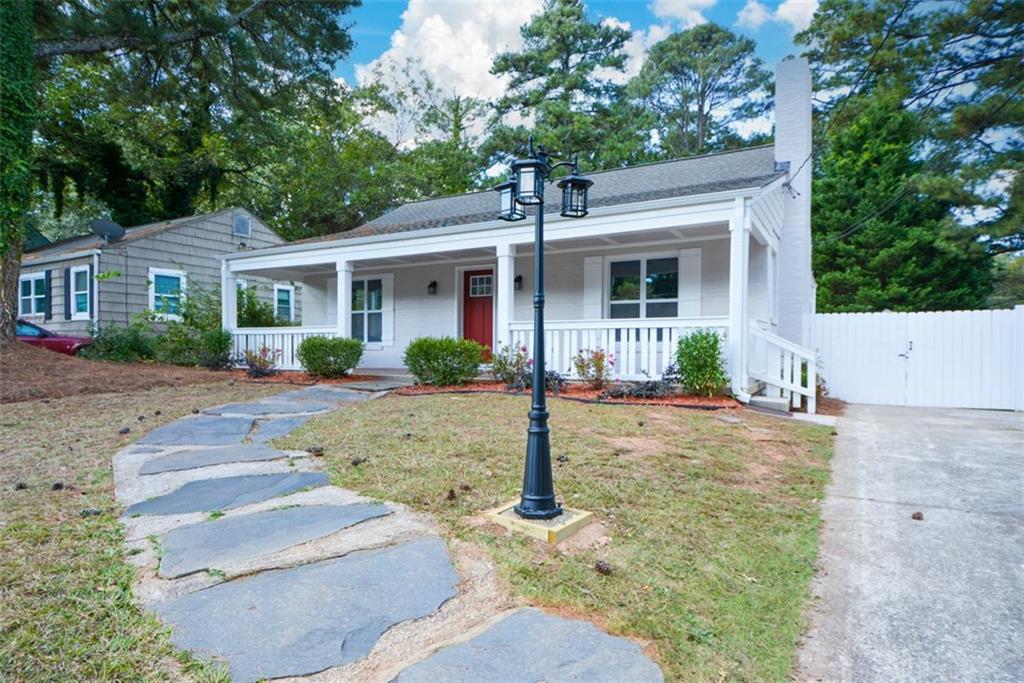 1275 Westridge Road Southwest Atlanta, GA 30311 - Photo 3 of 38 a view of a house with a yard and plants