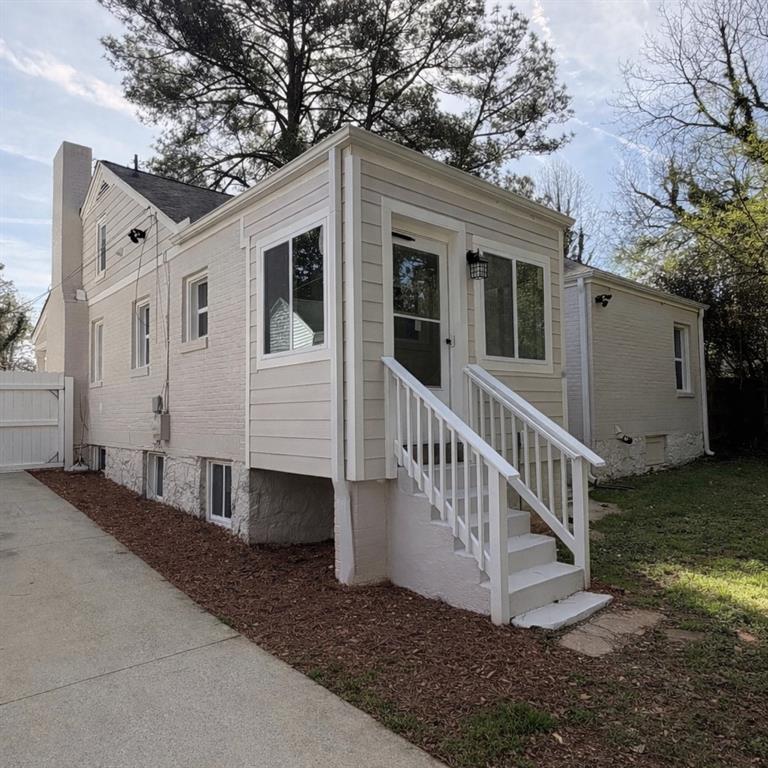 1275 Westridge Road Southwest Atlanta, GA 30311 - Photo 36 of 38 a view of a house with a yard