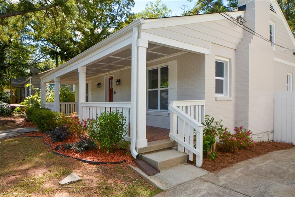 1275 Westridge Road Southwest Atlanta, GA 30311 - Photo 4 of 38 a view of a house with backyard and garden