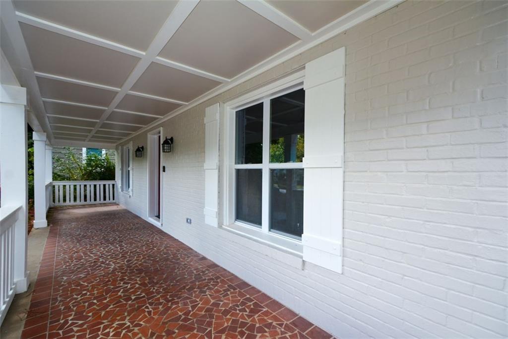 1275 Westridge Road Southwest Atlanta, GA 30311 - Photo 5 of 38 a view of backyard with a large window and wooden floor