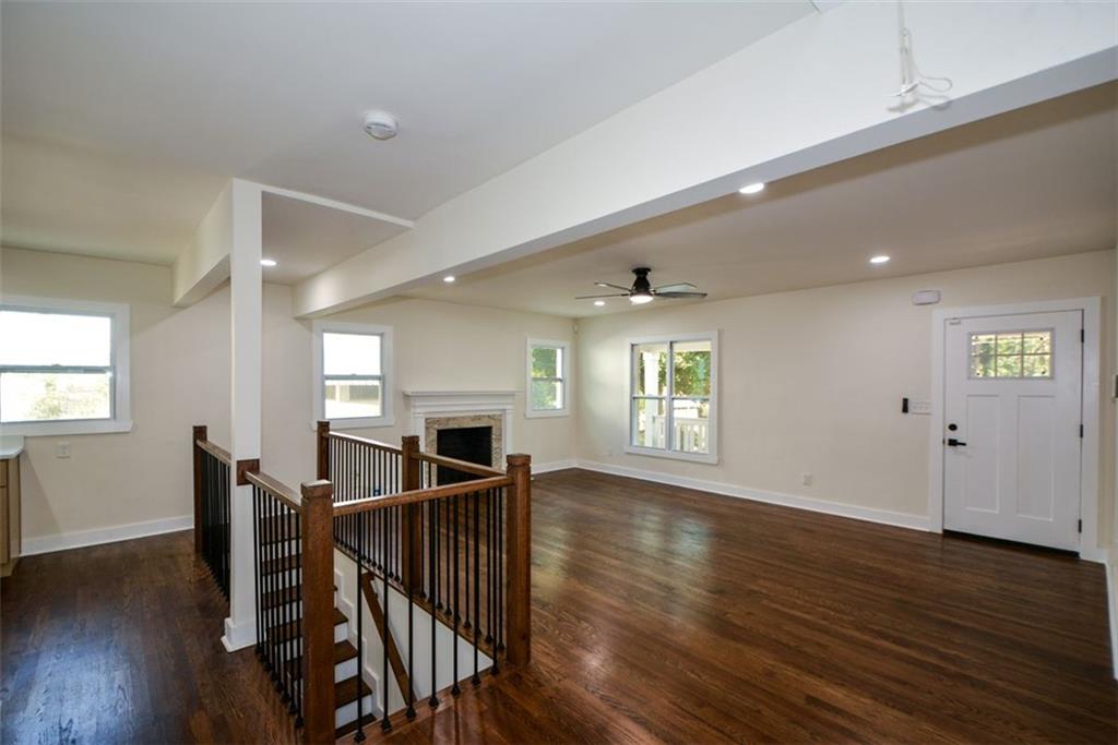 1275 Westridge Road Southwest Atlanta, GA 30311 - Photo 9 of 38 a view of a dining room with furniture and wooden floor