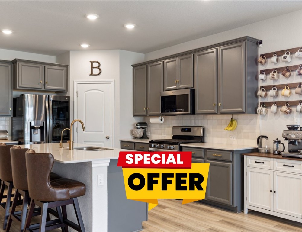 1001 A Dog Iron Street Georgetown, TX 78633 - Photo 1 of 25 a kitchen with stainless steel appliances granite countertop a stove top oven a sink and a refrigerator