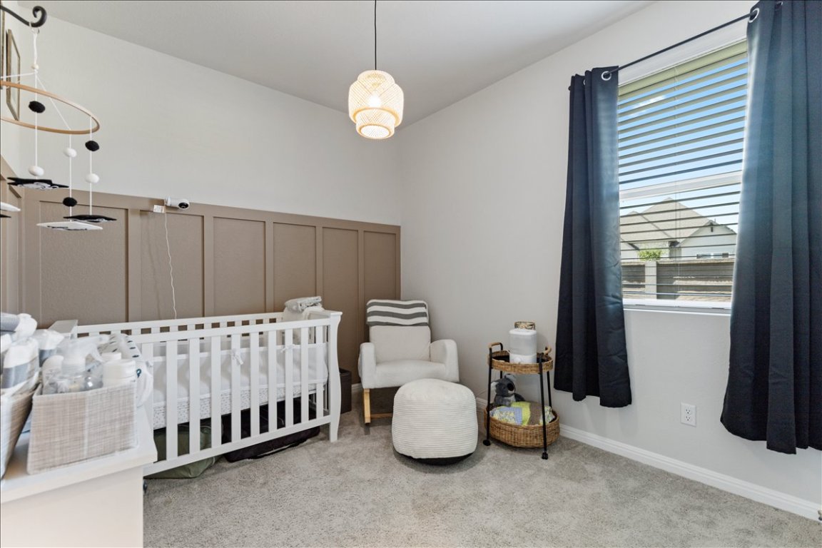 1001 A Dog Iron Street Georgetown, TX 78633 - Photo 18 of 25 a bedroom with bed and a window