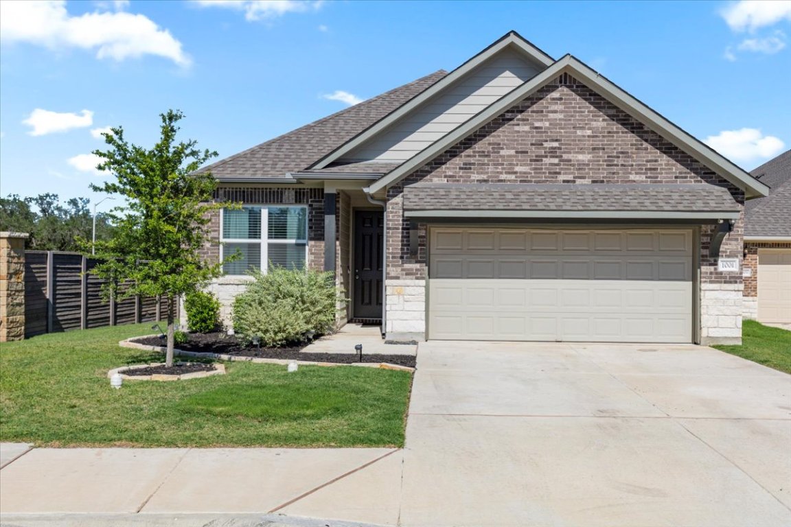1001 A Dog Iron Street Georgetown, TX 78633 - Photo 2 of 25 a front view of a house with a yard