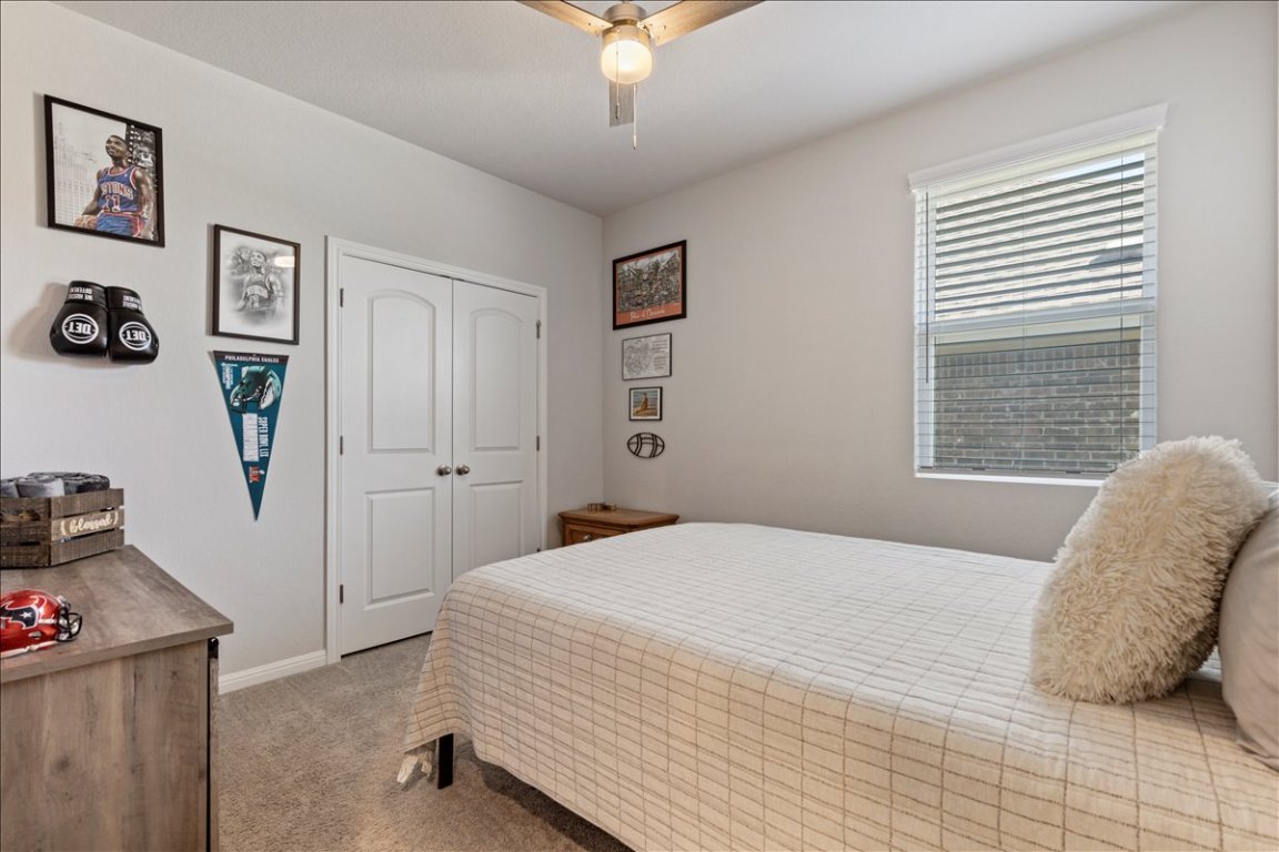 1001 A Dog Iron Street Georgetown, TX 78633 - Photo 20 of 25 a bedroom with a bed and a window