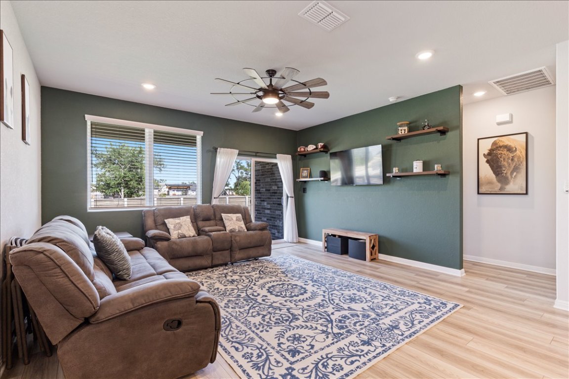 1001 A Dog Iron Street Georgetown, TX 78633 - Photo 8 of 25 a living room with furniture and a rug