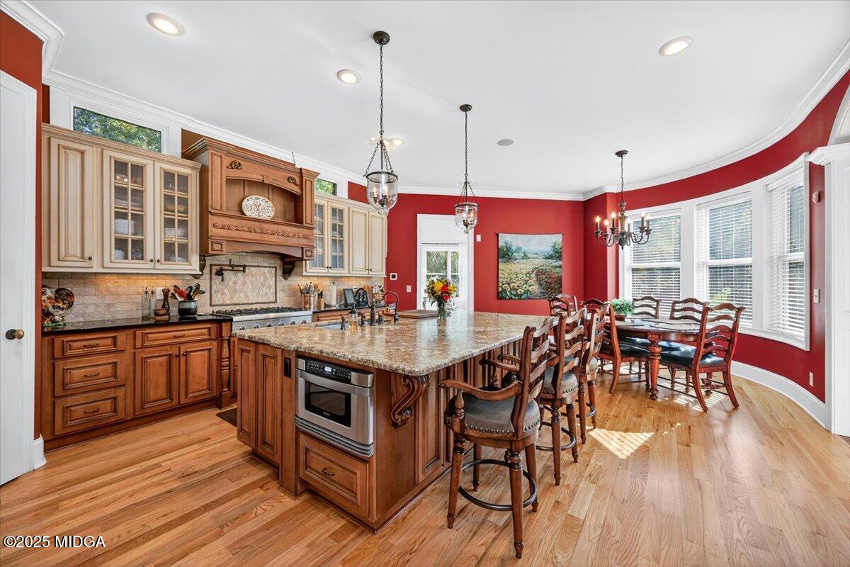 208 Crystal Drive Byron, GA 31008 - Photo 26 of 87 a kitchen with stainless steel appliances granite countertop a stove and refrigerator